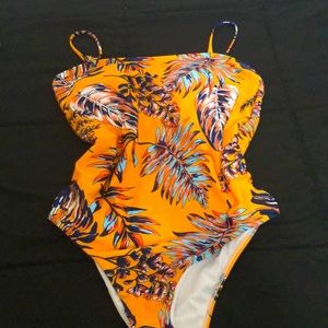 Brightly colored one piece bathing suit